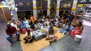 Participantes do BBB 26 em momento de tensão durante a dinâmica do paredão no cenário da casa do reality show.