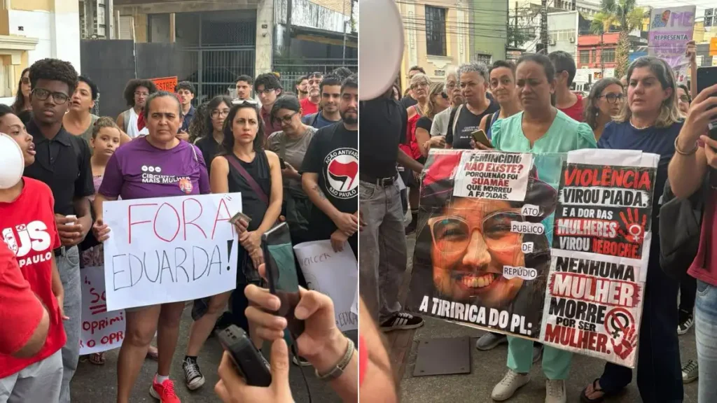 Manifestação contra homenagem de Eduarda Campopiano em frente à Câmara de Santos, com pessoas segurando cartazes e faixas
