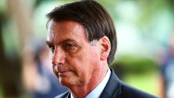 Bolsonaro em depoimento, em foto de perfil, durante atendimento à Polícia Civil após apreensão de arma em blitz, em contexto de investigação policial.