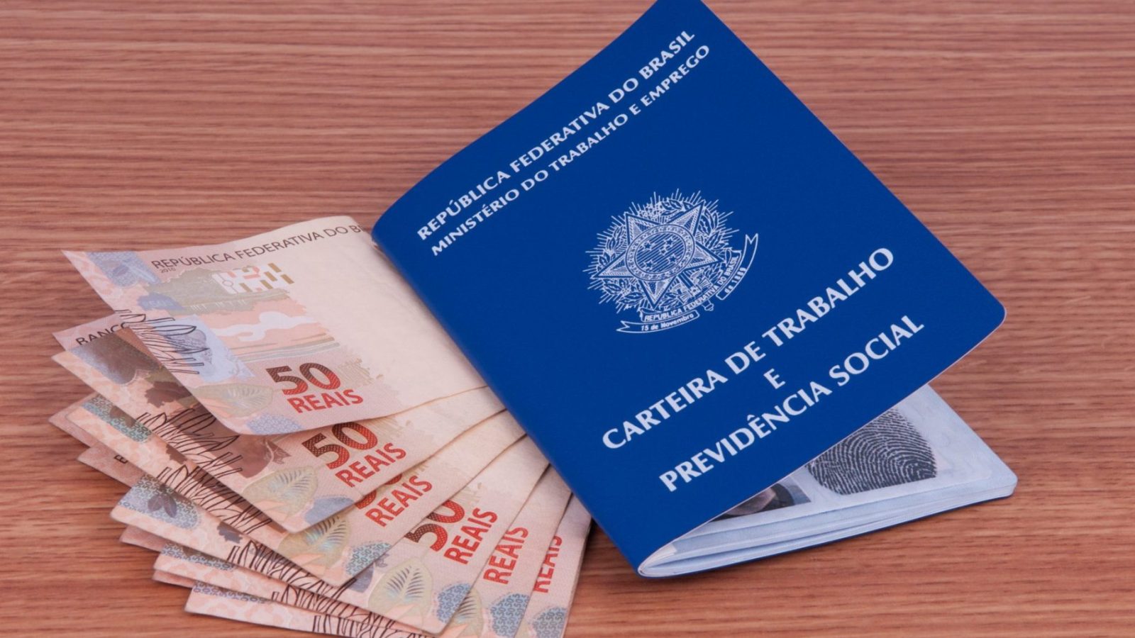 Brazilian work document and social security document (carteira de trabalho) and brazilian currency (Real)