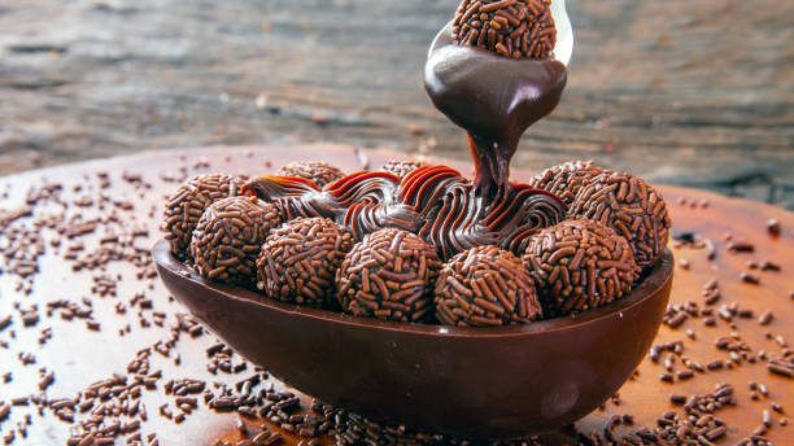 Brazilian easter egg stuffed with granulated chocolate and cream, tasted with a spoon. Easter tradition in Brazil