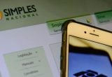 Notificação da Receita Federal sobre dívidas do Simples Nacional e MEI em tela de computador.